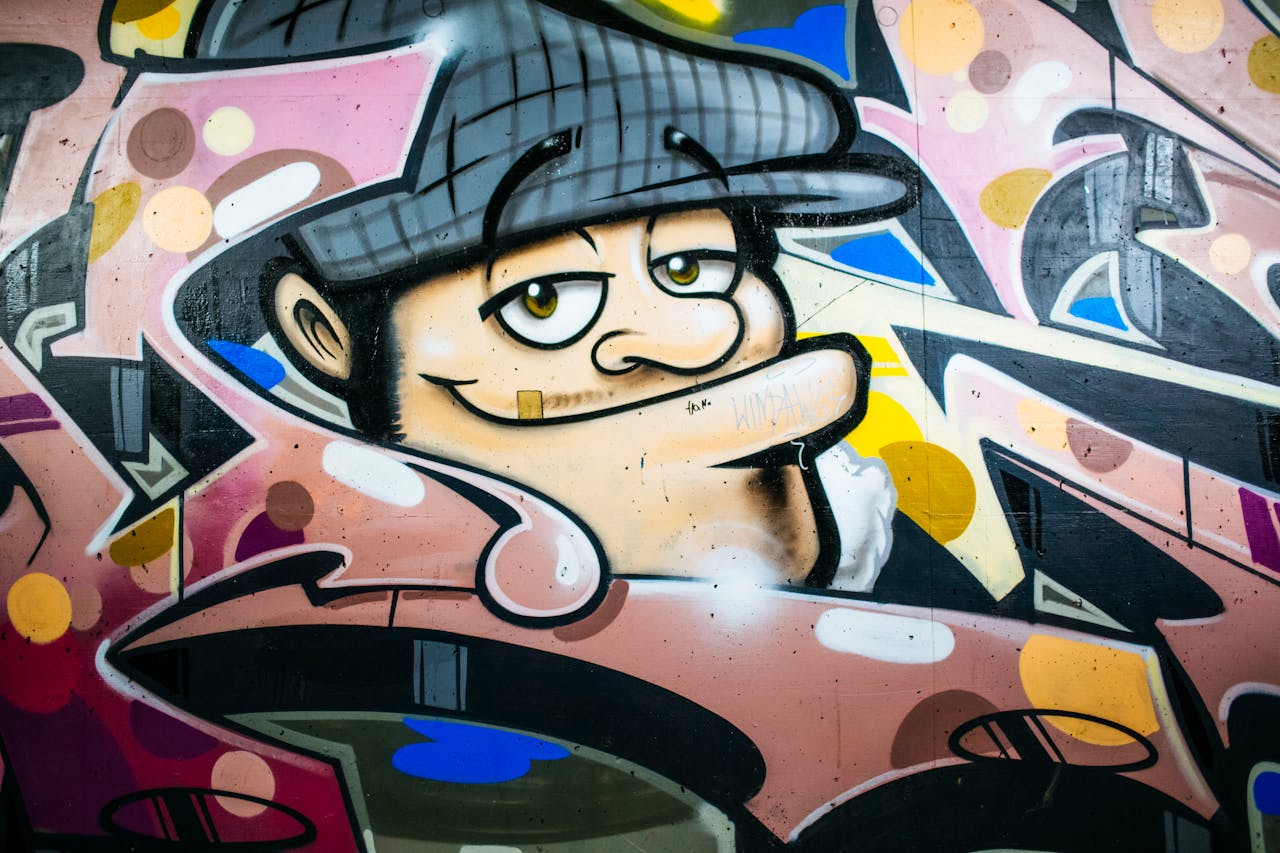 about-03 Vibrant street art mural featuring a whimsical character spray-painted on a city wall.